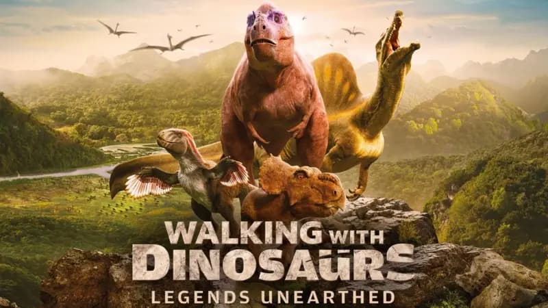 Walking with dinosaurs brand logo - four different dinosaurs posing dramatically together mid-roar - against a sunset over mountains and hills.